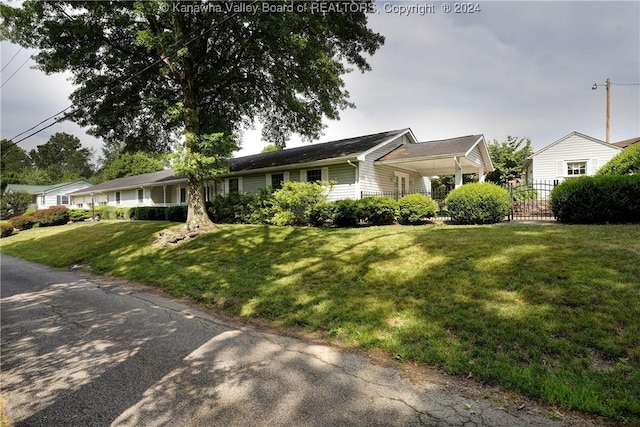 ranch-style house with a front lawn