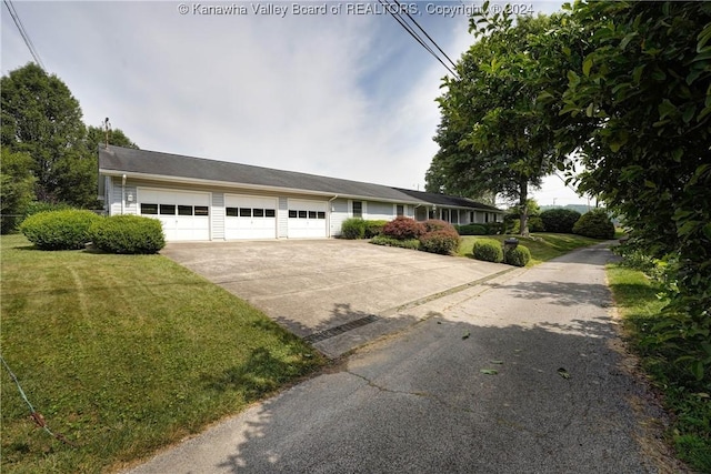 ranch-style home with a front lawn