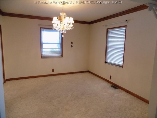 unfurnished room featuring ornamental molding, light carpet, and a chandelier