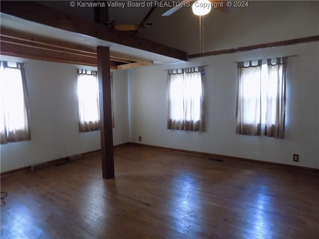 unfurnished room featuring hardwood / wood-style flooring, plenty of natural light, beam ceiling, and ceiling fan