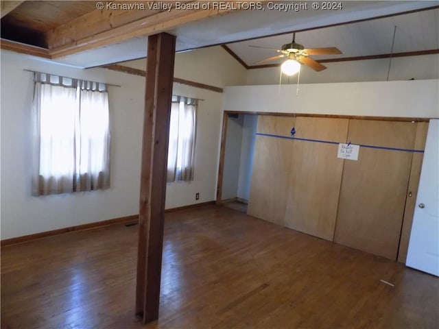 interior space featuring vaulted ceiling with beams, ceiling fan, and dark wood-type flooring