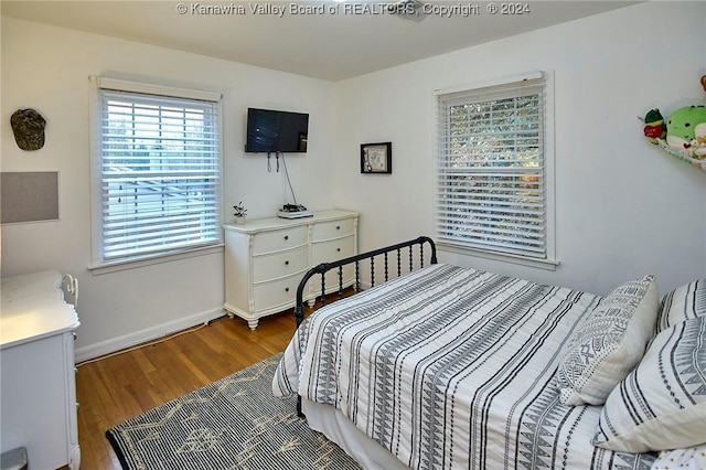 bedroom with hardwood / wood-style floors