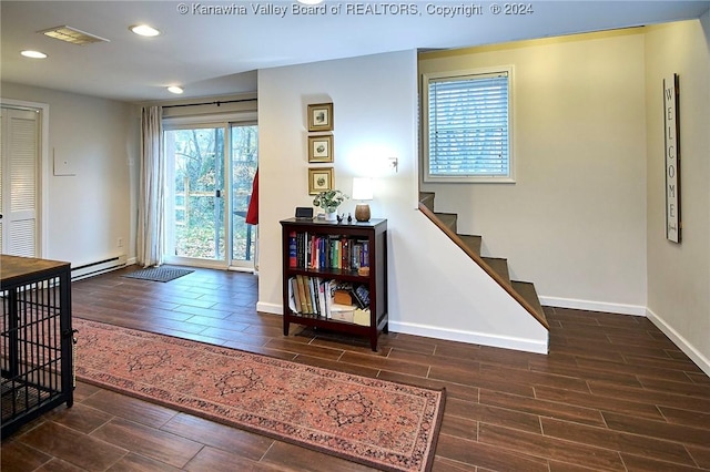 foyer featuring a baseboard heating unit