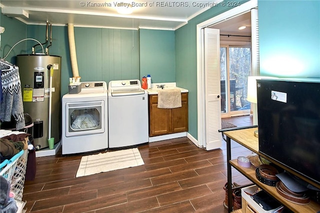 washroom with washer and dryer, dark hardwood / wood-style flooring, ornamental molding, and water heater