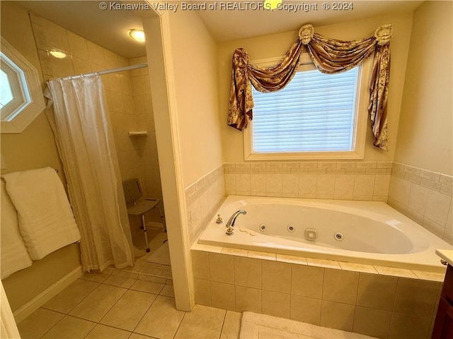 bathroom featuring plus walk in shower and tile patterned floors