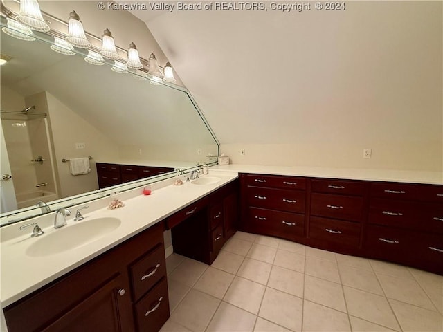 bathroom featuring tile patterned floors, vanity, lofted ceiling, and shower / bath combination