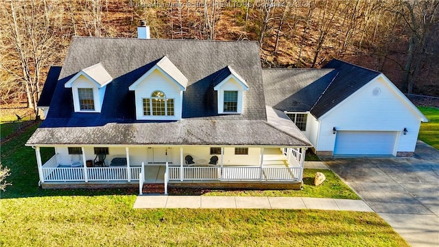 view of front of home featuring a garage and a front lawn