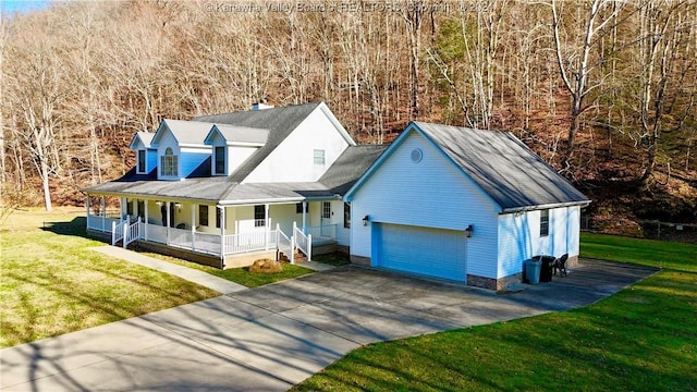 view of front of house featuring a porch, a garage, and a front lawn