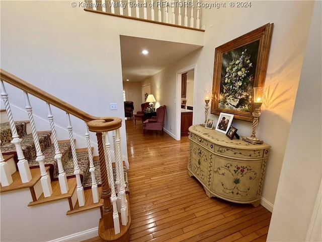 stairs with hardwood / wood-style floors