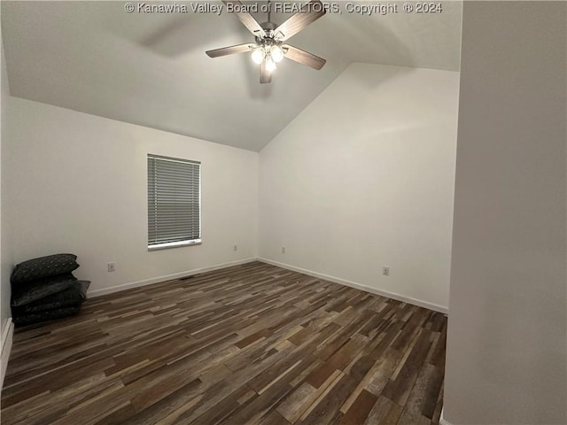 unfurnished room featuring ceiling fan, dark hardwood / wood-style flooring, and lofted ceiling