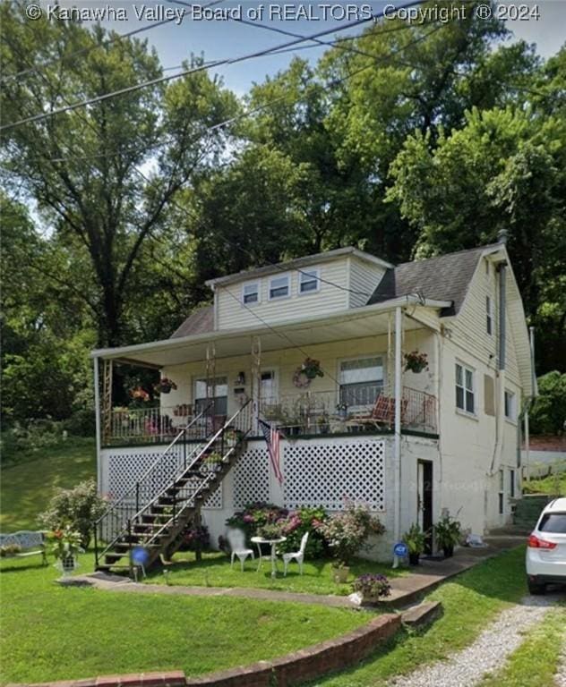 view of front of home with a front lawn and a porch