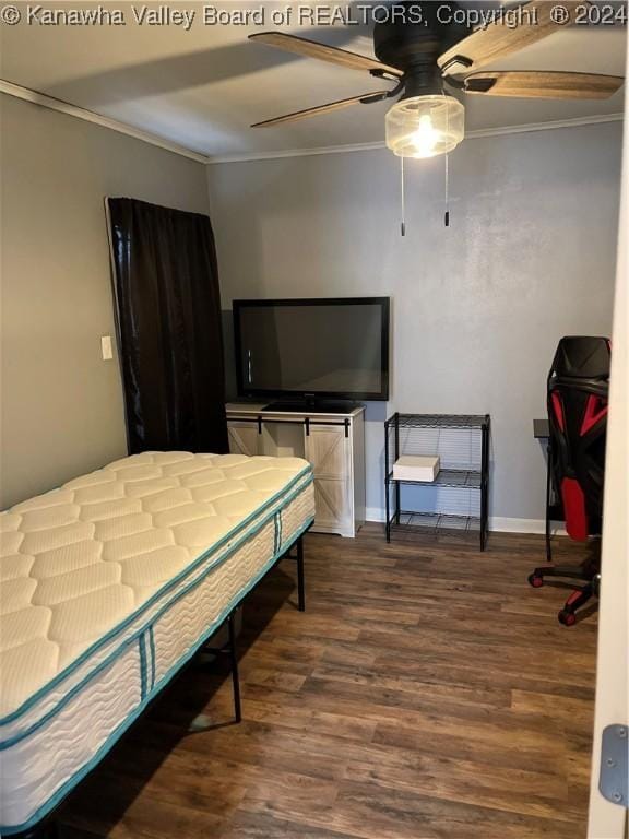 bedroom featuring ceiling fan, wood-type flooring, and ornamental molding