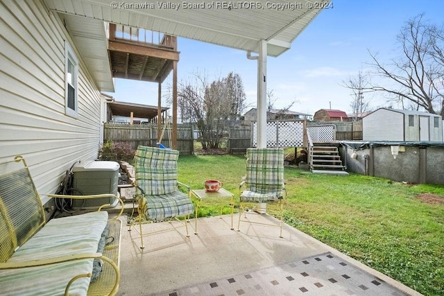 view of patio featuring a covered pool