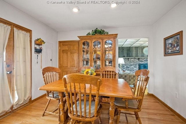 dining space with light hardwood / wood-style flooring