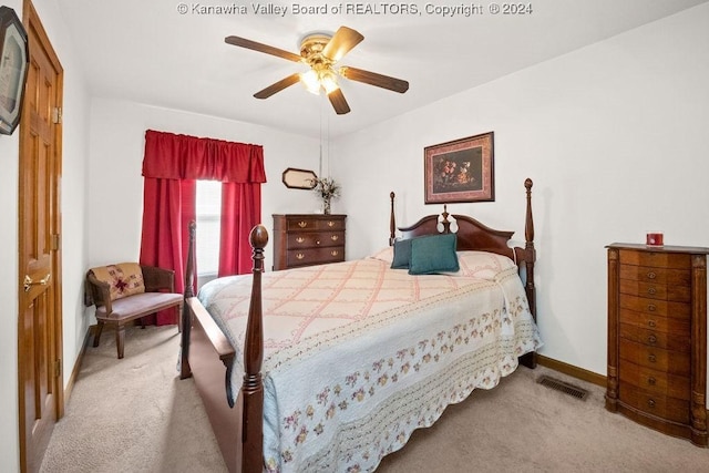 bedroom featuring ceiling fan and light colored carpet