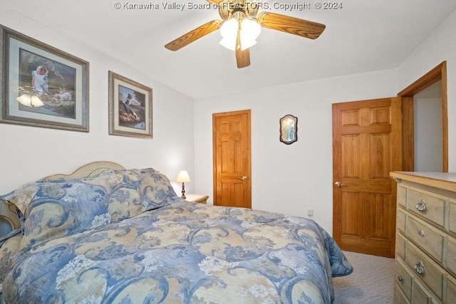 carpeted bedroom featuring ceiling fan