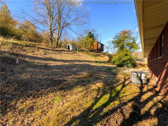 view of yard with central AC unit