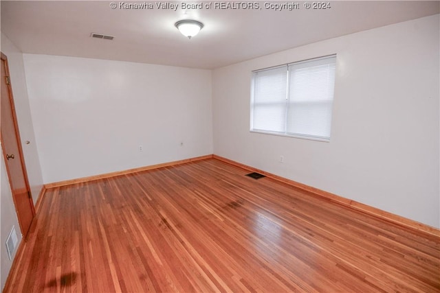 empty room featuring wood-type flooring