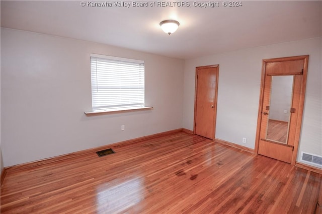 unfurnished bedroom featuring wood-type flooring