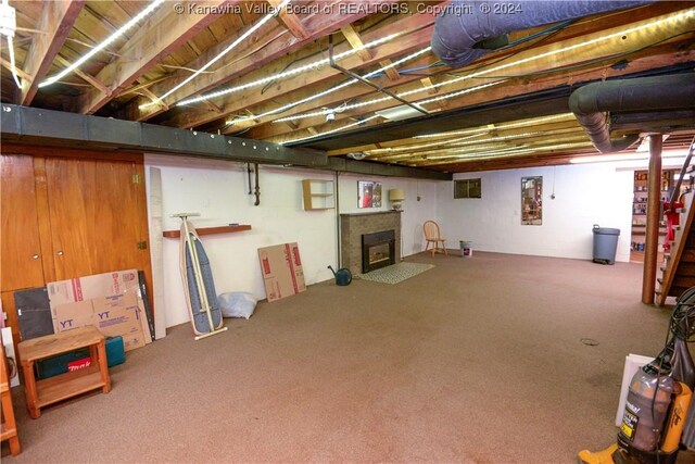 basement featuring carpet flooring