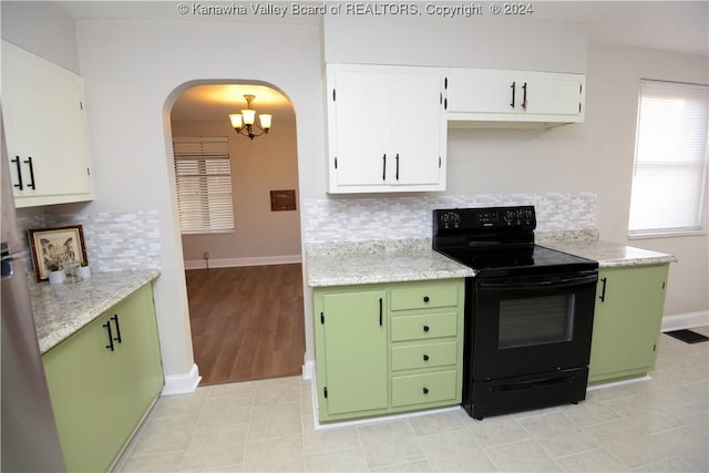 kitchen with white cabinets, decorative backsplash, black range with electric cooktop, and green cabinetry