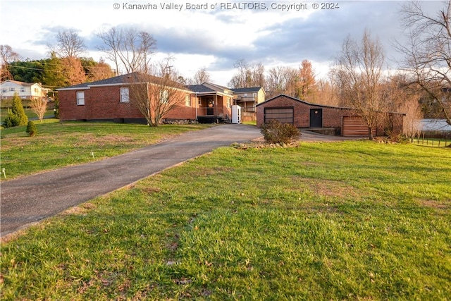 view of front of property with a garage and a front yard