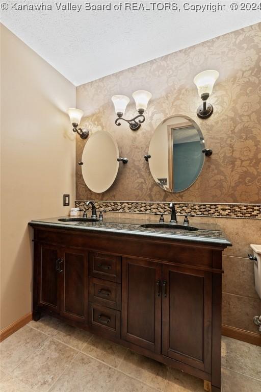 bathroom with tile patterned floors and vanity