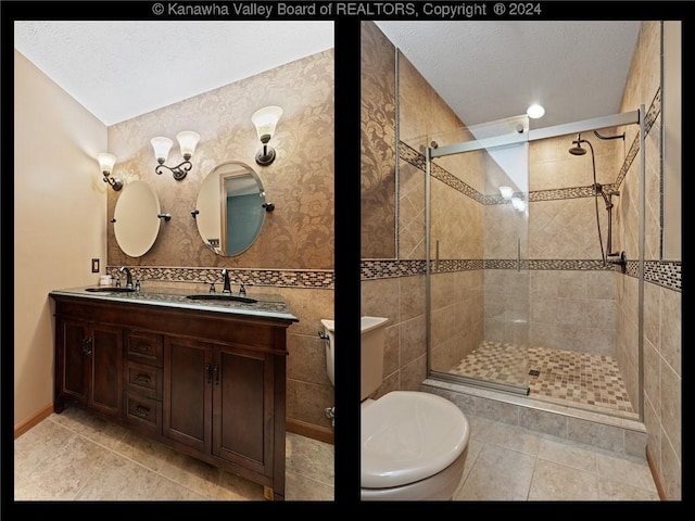 bathroom with tile patterned floors, vanity, a shower with shower door, and a textured ceiling