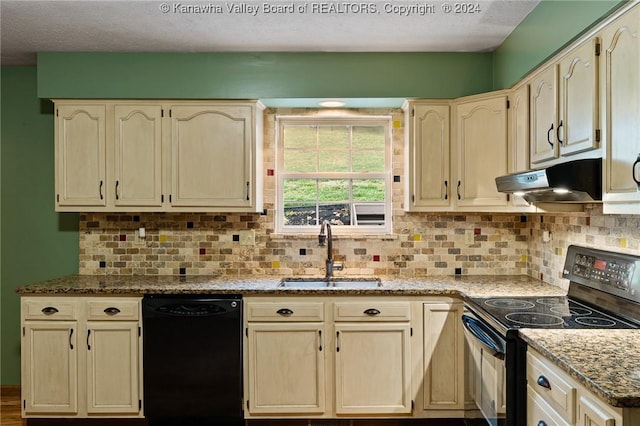 kitchen with sink, backsplash, light stone counters, and black appliances