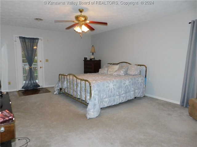 carpeted bedroom with access to exterior and ceiling fan