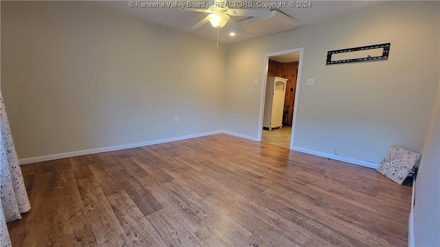 empty room with light hardwood / wood-style floors and ceiling fan