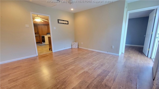 unfurnished room with light wood-type flooring