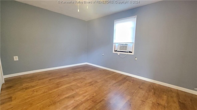 unfurnished room featuring hardwood / wood-style floors