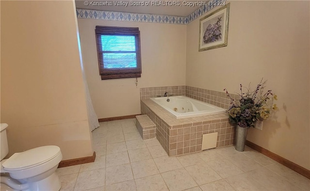 bathroom featuring tile patterned floors, tiled bath, and toilet