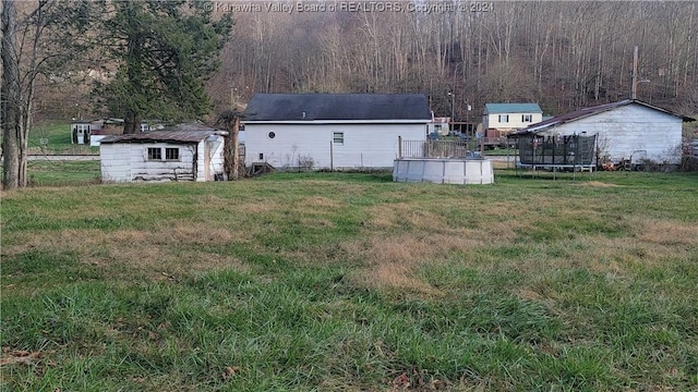 view of yard featuring a trampoline