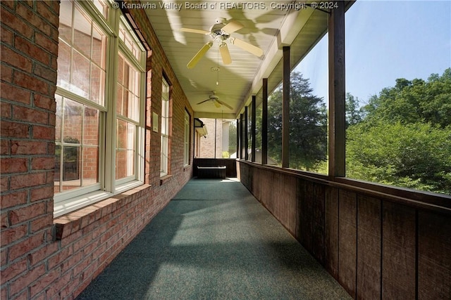 exterior space featuring ceiling fan