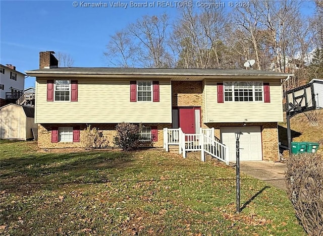 raised ranch with a front lawn and a garage