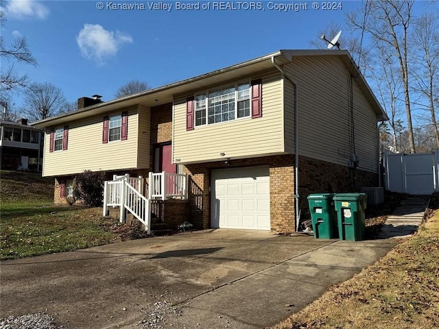 bi-level home with central AC and a garage