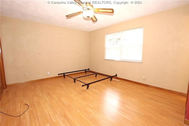 unfurnished room featuring ceiling fan and light hardwood / wood-style flooring