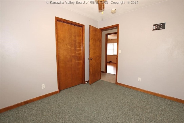 unfurnished bedroom with carpet floors