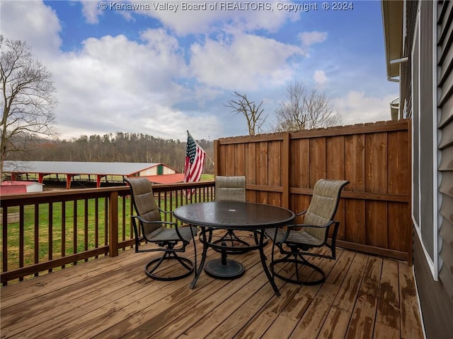 deck featuring a lawn