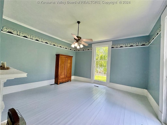 unfurnished bedroom featuring ceiling fan, crown molding, and light hardwood / wood-style flooring