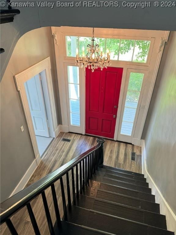 foyer featuring a notable chandelier and hardwood / wood-style flooring