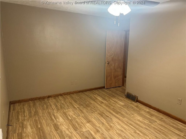 unfurnished room featuring ceiling fan and light hardwood / wood-style flooring