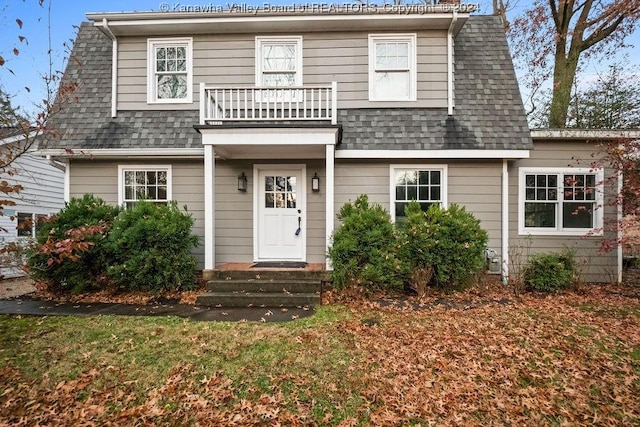 front of property featuring a balcony