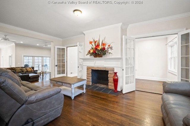 living room featuring crown molding, ceiling fan, french doors, and hardwood / wood-style floors