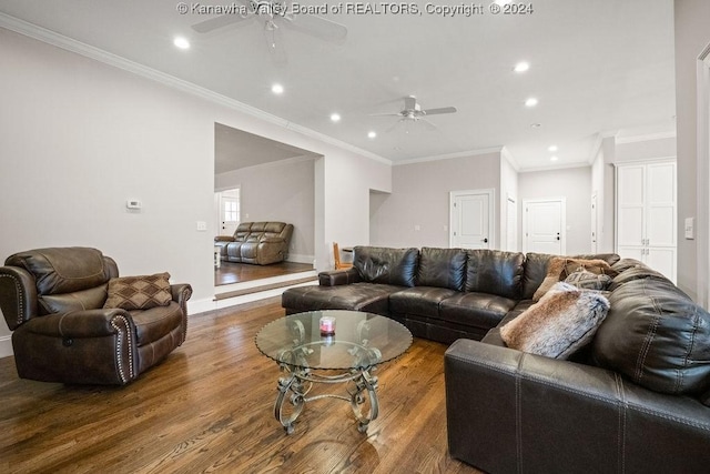 living room featuring ceiling fan, wood-type flooring, and ornamental molding