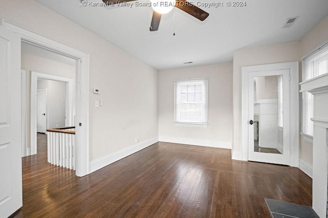 unfurnished room featuring dark hardwood / wood-style flooring and ceiling fan