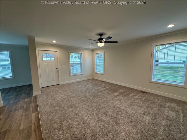 interior space with crown molding, dark hardwood / wood-style flooring, and ceiling fan