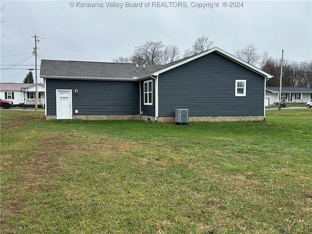 view of home's exterior featuring a yard and central air condition unit